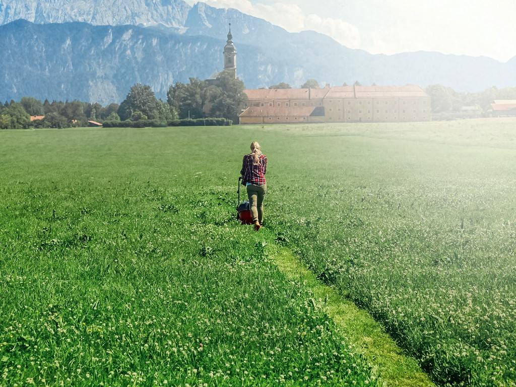 woman mowing lawn