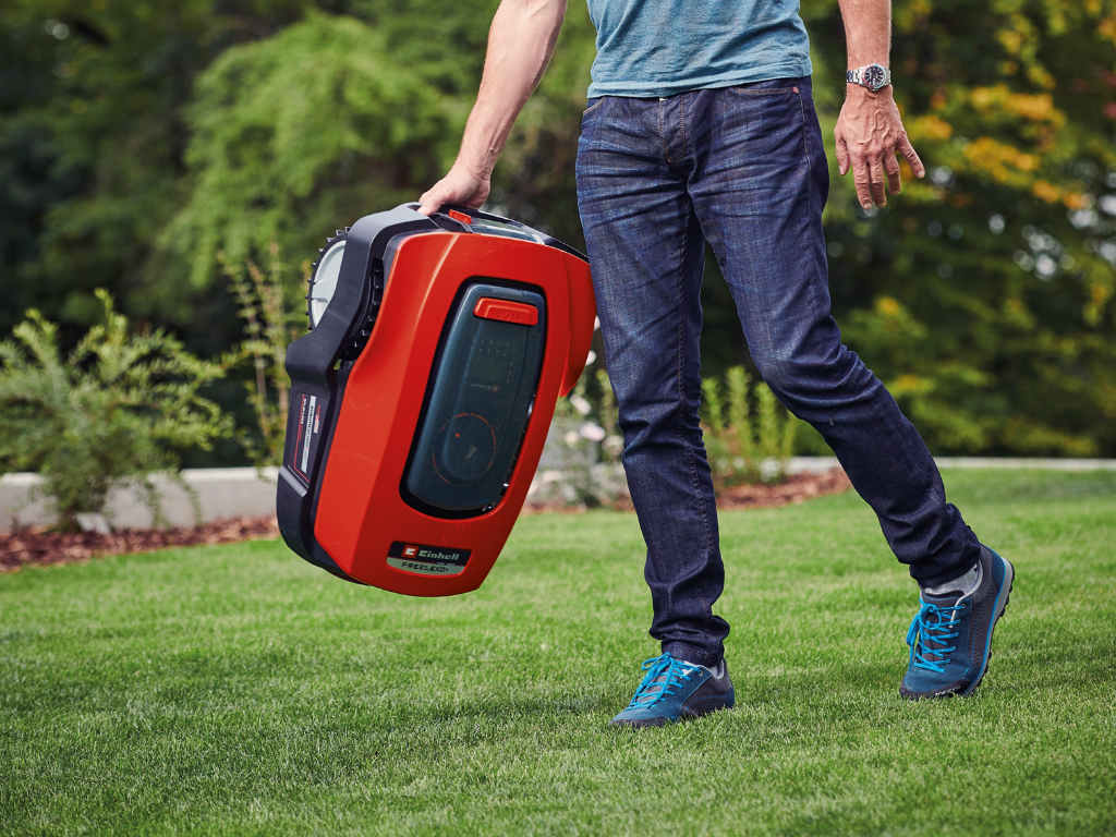 Lawn mower robot is held in hand