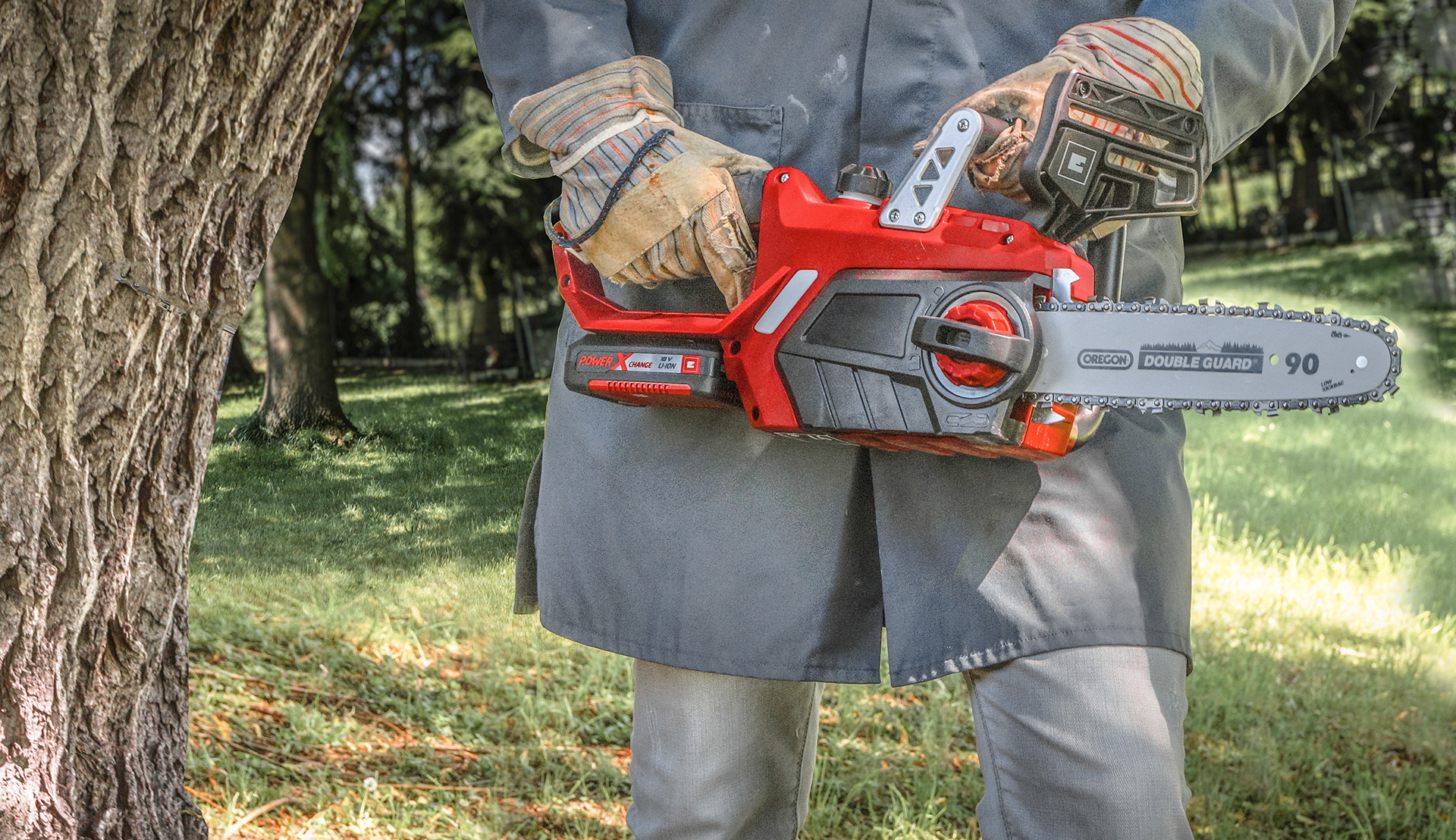 a man holds a chainsaw in his hand